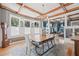Stylish dining room with natural light, charming chandelier, and seamlessly connecting to living spaces at 1005 Main St, Safety Harbor, FL 34695