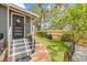 Inviting front entrance featuring a brick pathway, well-manicured lawn, and charming details at 1005 Main St, Safety Harbor, FL 34695