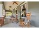 Spacious front porch featuring rocking chairs and vintage decor, ideal for enjoying the outdoors at 1005 Main St, Safety Harbor, FL 34695