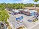 Aerial shot of Harbor Bar featuring outdoor seating, signage, and ample parking at 1005 Main St, Safety Harbor, FL 34695