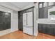 The modern kitchen has custom cabinets, stainless steel appliances, and granite countertops at 1005 Main St, Safety Harbor, FL 34695