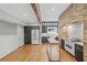 A full kitchen boasts brick surround for the range, and black cabinets at 1005 Main St, Safety Harbor, FL 34695