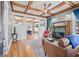 Cozy living room with hardwood floors, coffered ceilings, fireplace, and adjacent dining area at 1005 Main St, Safety Harbor, FL 34695