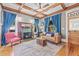 Elegant living room with a fireplace, coffered ceiling, hardwood floors, and stylish furnishings at 1005 Main St, Safety Harbor, FL 34695