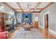 Bright living room featuring a fireplace, hardwood floors, stylish furnishings, and abundant natural light at 1005 Main St, Safety Harbor, FL 34695