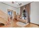 Living room with hardwood floors, staircase, and doorway to another room at 1005 Main St, Safety Harbor, FL 34695