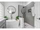 Luxurious bathroom boasting a freestanding tub, glass-enclosed shower, and contemporary finishes at 10112 Downey Ln, Tampa, FL 33626