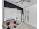 Multipurpose room with a murphy bed and workstation, offering flexibility and stylish functionality at 10112 Downey Ln, Tampa, FL 33626