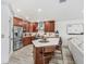Modern kitchen with stainless steel appliances and a center island with seating at 10112 Downey Ln, Tampa, FL 33626