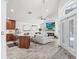 Open living area boasts wood-look floors, modern accents, and white walls at 10112 Downey Ln, Tampa, FL 33626