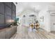 Spacious living room showcasing wood-look floors, vaulted ceilings, and abundance of natural light at 10112 Downey Ln, Tampa, FL 33626