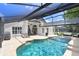 Stunning screened-in pool area with a patio, lounge chairs, and outdoor kitchen, ideal for Florida living at 10112 Downey Ln, Tampa, FL 33626