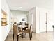 Cozy dining area with a mirrored wall, adjacent to the kitchen, perfect for intimate gatherings at 1109 Pine Ridge W Cir # C1, Tarpon Springs, FL 34688