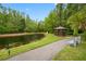 Charming gazebo nestled by a serene pond, offering a relaxing spot surrounded by nature at 1109 Pine Ridge W Cir # C1, Tarpon Springs, FL 34688