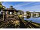 Community gazebo overlooking a pond, offering a serene and picturesque view of the community at 1109 Pine Ridge W Cir # C1, Tarpon Springs, FL 34688