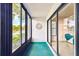 Enclosed lanai with windows offering scenic water views at 1109 Pine Ridge W Cir # C1, Tarpon Springs, FL 34688