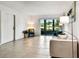 Inviting living room with lake views through sliding glass doors, offering a serene and relaxing ambiance at 1109 Pine Ridge W Cir # C1, Tarpon Springs, FL 34688