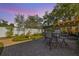 Landscaped backyard includes brick patio, water fountain, and private seating area at 11125 117Th St, Seminole, FL 33778