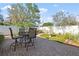 Backyard patio featuring brick pavers, a fountain, and outdoor seating at 11125 117Th St, Seminole, FL 33778