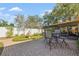 Relaxing backyard patio with brick pavers, a fountain, and screened in porch at 11125 117Th St, Seminole, FL 33778