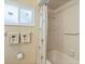 Bathroom showcasing a shower with a shower curtain and decorated window at 11125 117Th St, Seminole, FL 33778