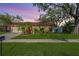 Charming single-story home with a well-maintained lawn and manicured landscaping at 11125 117Th St, Seminole, FL 33778