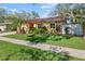 Lovely single-story home with a lush green lawn and mature landscaping at 11125 117Th St, Seminole, FL 33778