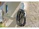 Home exterior showing an electric vehicle charger attached to the wall at 11125 117Th St, Seminole, FL 33778