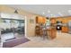 Eat-in kitchen featuring granite countertops, stainless steel appliances, and a view of the screened patio at 11125 117Th St, Seminole, FL 33778