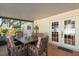 Outdoor lanai offers covered seating area with tile flooring, perfect for enjoying the outdoors at 11125 117Th St, Seminole, FL 33778