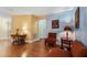 Inviting living room boasting hardwood floors and a harmonious blend of yellow and blue accent walls at 11125 117Th St, Seminole, FL 33778