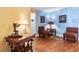 Comfortable living area with hardwood flooring, stylish lamps, and tasteful wall decor at 11125 117Th St, Seminole, FL 33778