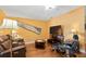 Relaxing living room featuring reclining leather furniture and a ceiling fan for added comfort at 11125 117Th St, Seminole, FL 33778