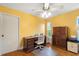 Office area with yellow walls, hardwood floors, and lots of natural light at 11125 117Th St, Seminole, FL 33778