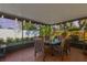 Enclosed patio features string lights, tile floor, and comfortable seating arrangement at 11125 117Th St, Seminole, FL 33778