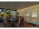 Covered patio with a dining table and chairs, perfect for outdoor entertaining at 11125 117Th St, Seminole, FL 33778