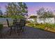 Backyard featuring brick patio, fountain, bench and mature trees at 11125 117Th St, Seminole, FL 33778