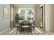 Bright dining room featuring a modern table set, large windows, neutral curtains and stylish decor at 11515 E 69Th Pl, Palmetto, FL 34221