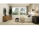 Cozy main bedroom featuring a comfortable bed, stylish furnishings, and large windows for natural light at 11515 E 69Th Pl, Palmetto, FL 34221