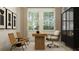 Modern home office with sleek furnishings, a large window, and art at 11515 E 69Th Pl, Palmetto, FL 34221