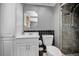 Updated bathroom features a shower, a vanity, and a toilet at 1281 Amberlea E Dr, Dunedin, FL 34698