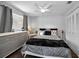 Stylish bedroom featuring a gray color scheme, decorative pillows, and ample storage at 1281 Amberlea E Dr, Dunedin, FL 34698