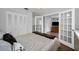 Neutral bedroom with generous closet space and connecting doors to additional living space at 1281 Amberlea E Dr, Dunedin, FL 34698