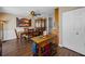 Dining room features a decorative ceiling fan, chair railing, and vintage china cabinet at 1281 Amberlea E Dr, Dunedin, FL 34698