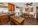 Dining room features sliding glass doors to the lanai and eat-in kitchen at 1281 Amberlea E Dr, Dunedin, FL 34698