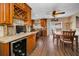 Dining room features a wet bar with mini fridge and a sliding glass door at 1281 Amberlea E Dr, Dunedin, FL 34698