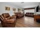 Cozy living room with hardwood floors and comfortable furniture at 1281 Amberlea E Dr, Dunedin, FL 34698
