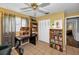 Bright home office with tiled floor, large closet, and an open view to living area at 1281 Amberlea E Dr, Dunedin, FL 34698