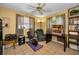 Comfortable home office featuring a ceiling fan, and exercise machine at 1281 Amberlea E Dr, Dunedin, FL 34698