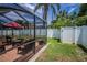 Screened patio and fenced yard offers private outdoor enjoyment at 1281 Amberlea E Dr, Dunedin, FL 34698